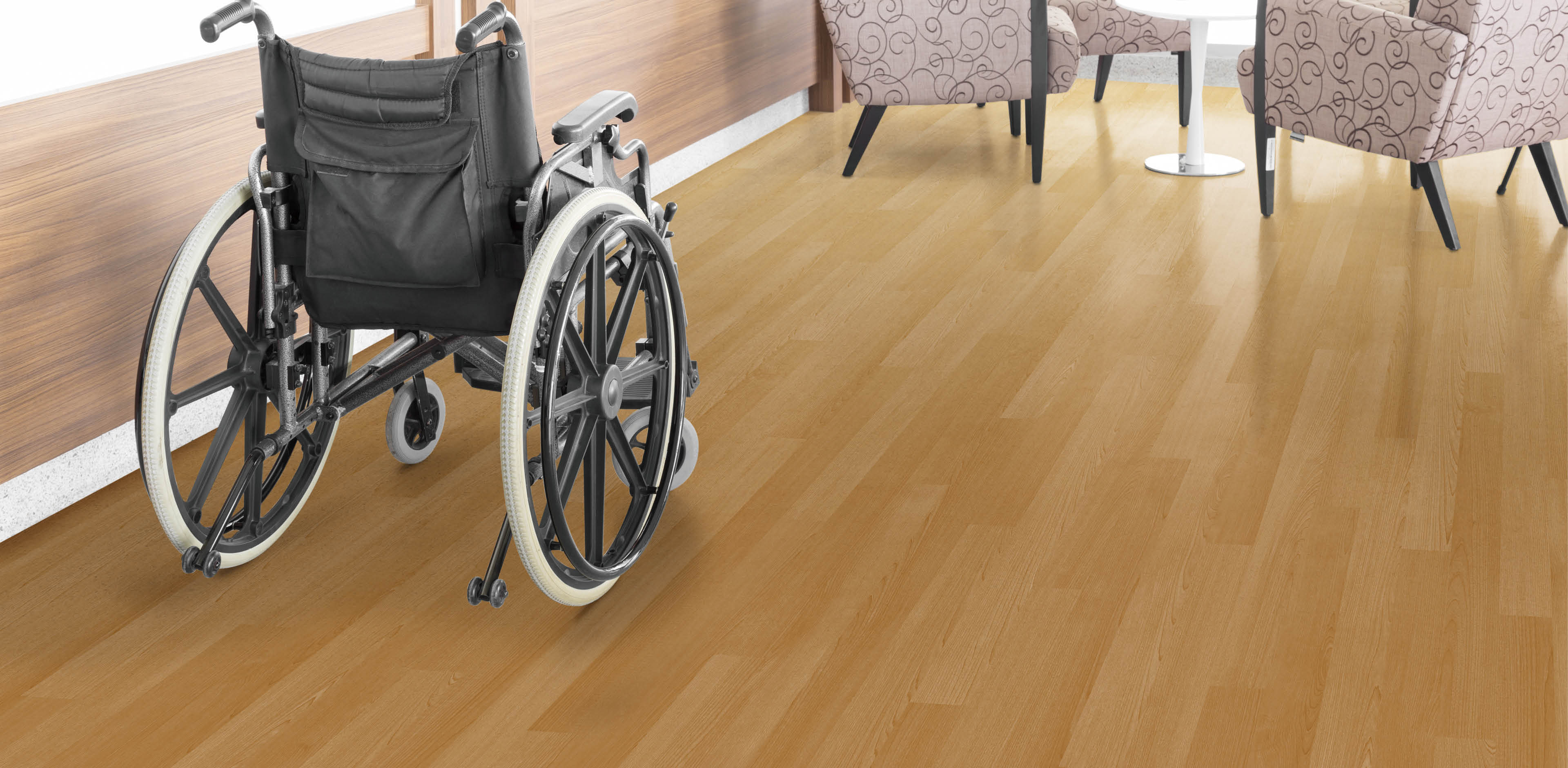 Empty wheelchair parked in hospital hallway