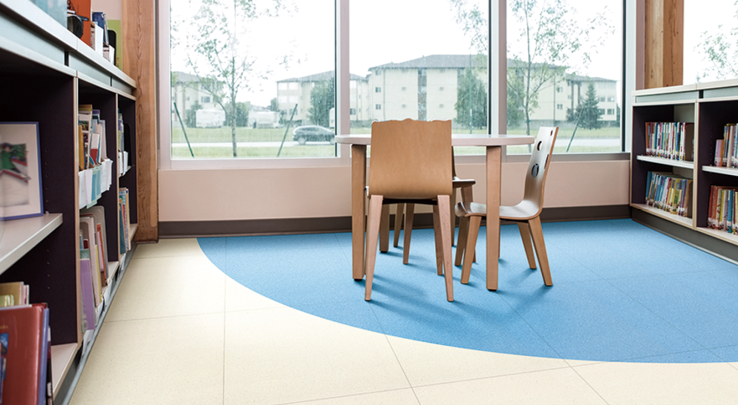 Interior of library with bookshelves and seating arrangement; Shutterstock ID 225428074