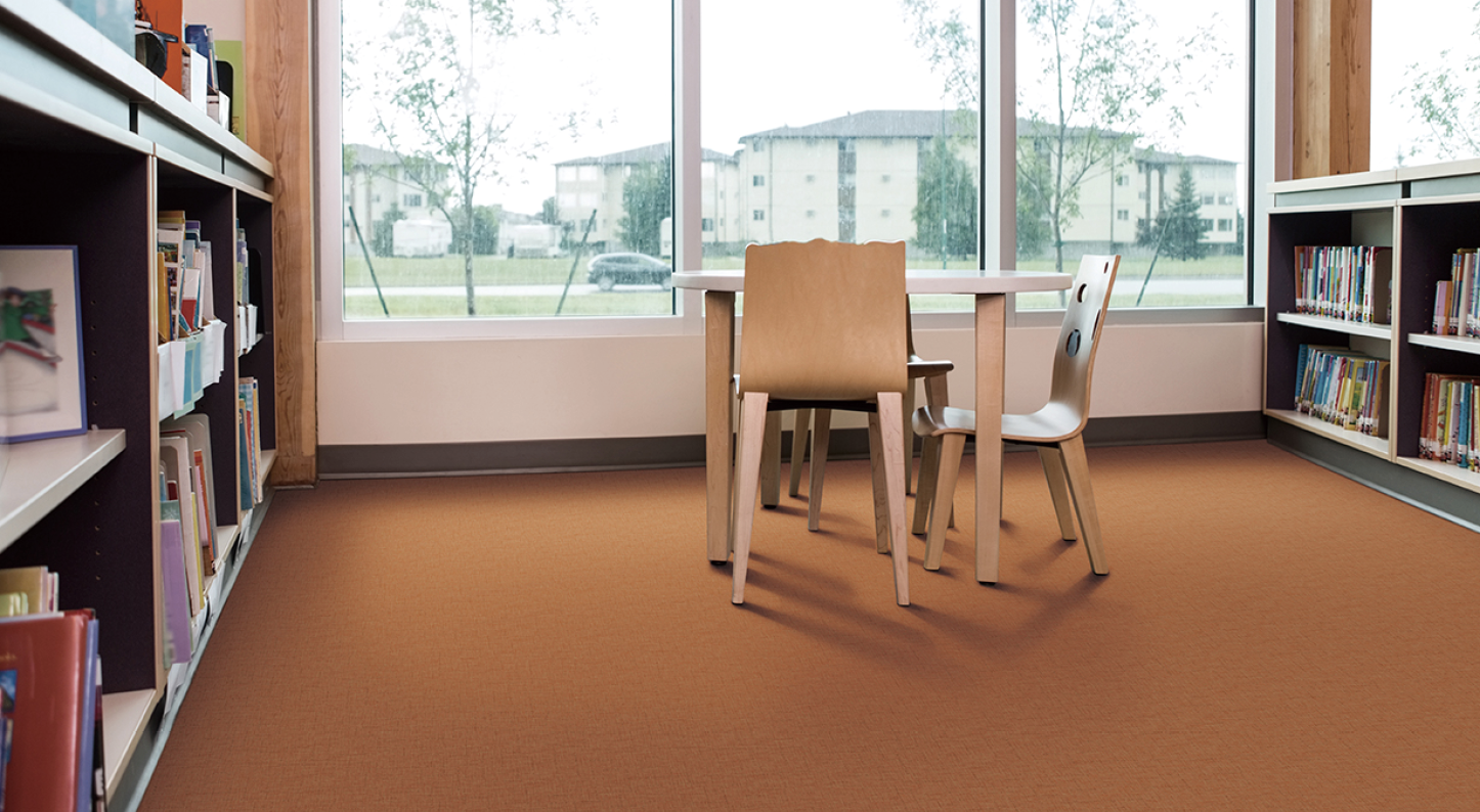 Interior of library with bookshelves and seating arrangement; Shutterstock ID 225428074