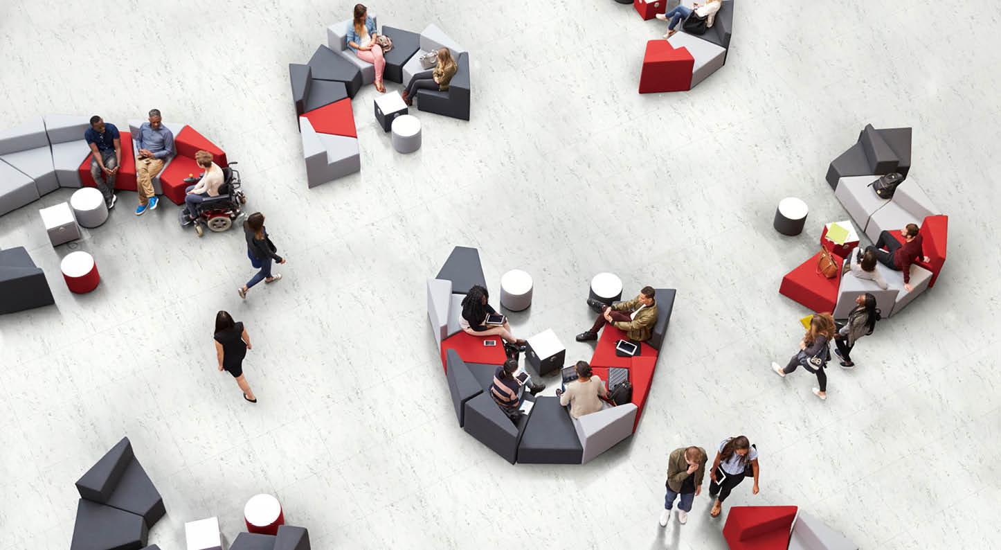 Students in the atrium of modern university, elevated view