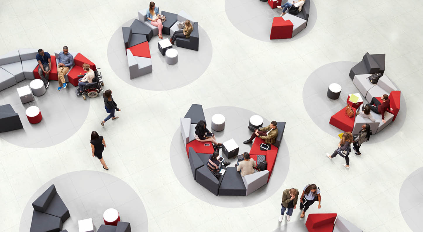 Students in the atrium of modern university, elevated view
