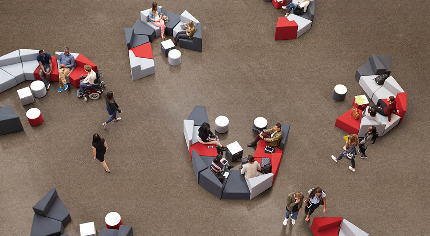 Students in the atrium of modern university, elevated view